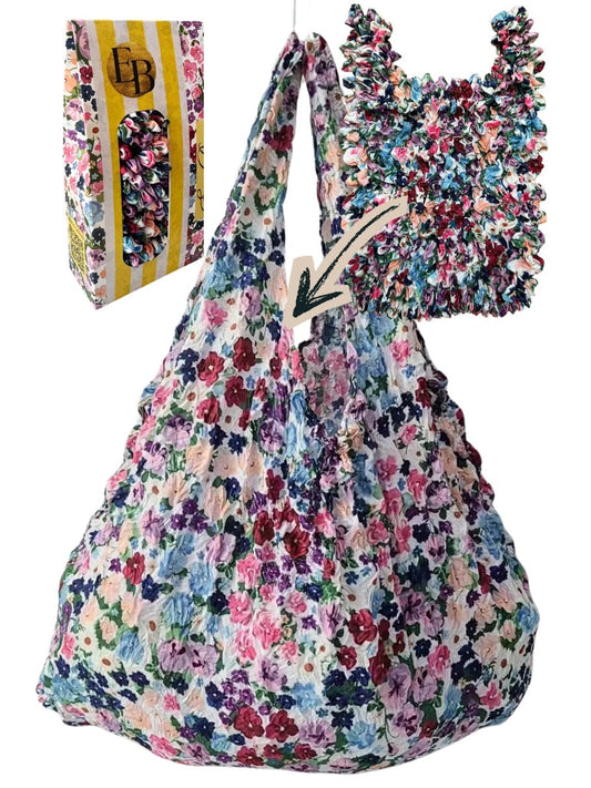 Be Bougie floral print eco-friendly stretchy tote bag with a crinkled texture and wide shoulder straps.