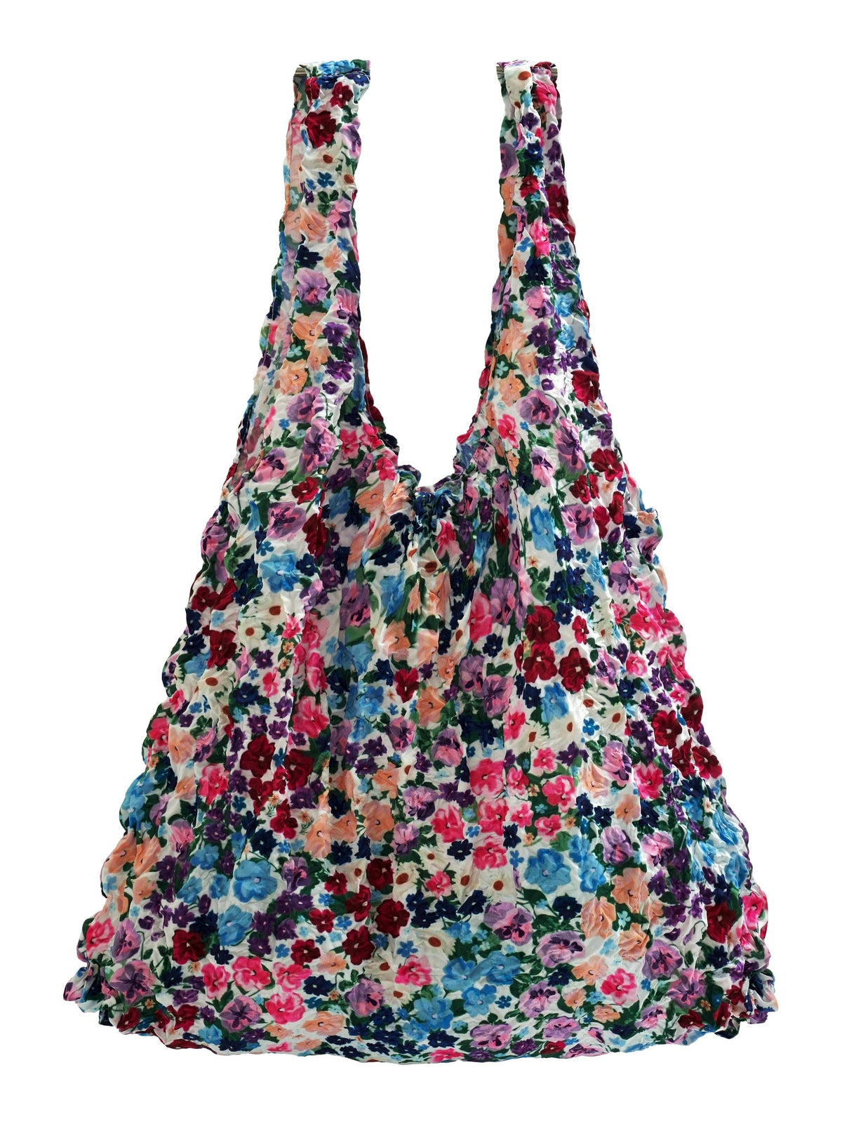 Be Bougie eco-friendly tote bag featuring a vibrant multi-colored floral ditsy print and a stretchy crinkled texture.