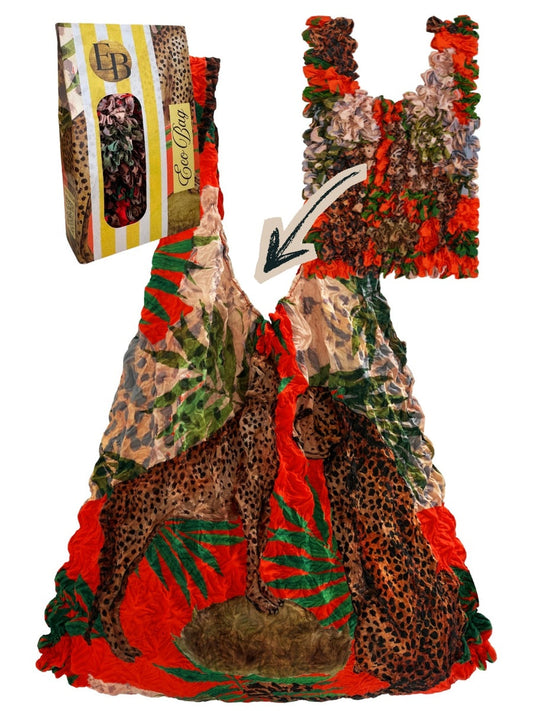 Be Bougie reusable eco-friendly tote bag featuring a leopard and palm print in orange and green with textured fabric.