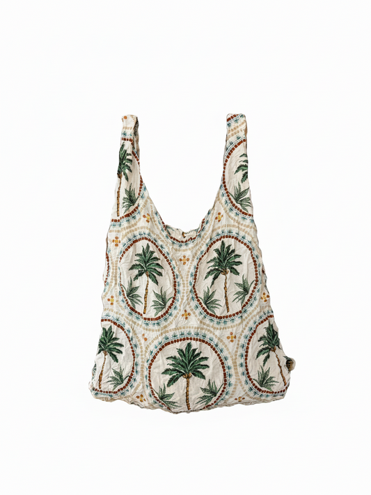 Be Bougie palm tree mosaic print eco-friendly stretchy tote bag in cream, green, and brown on a white background.