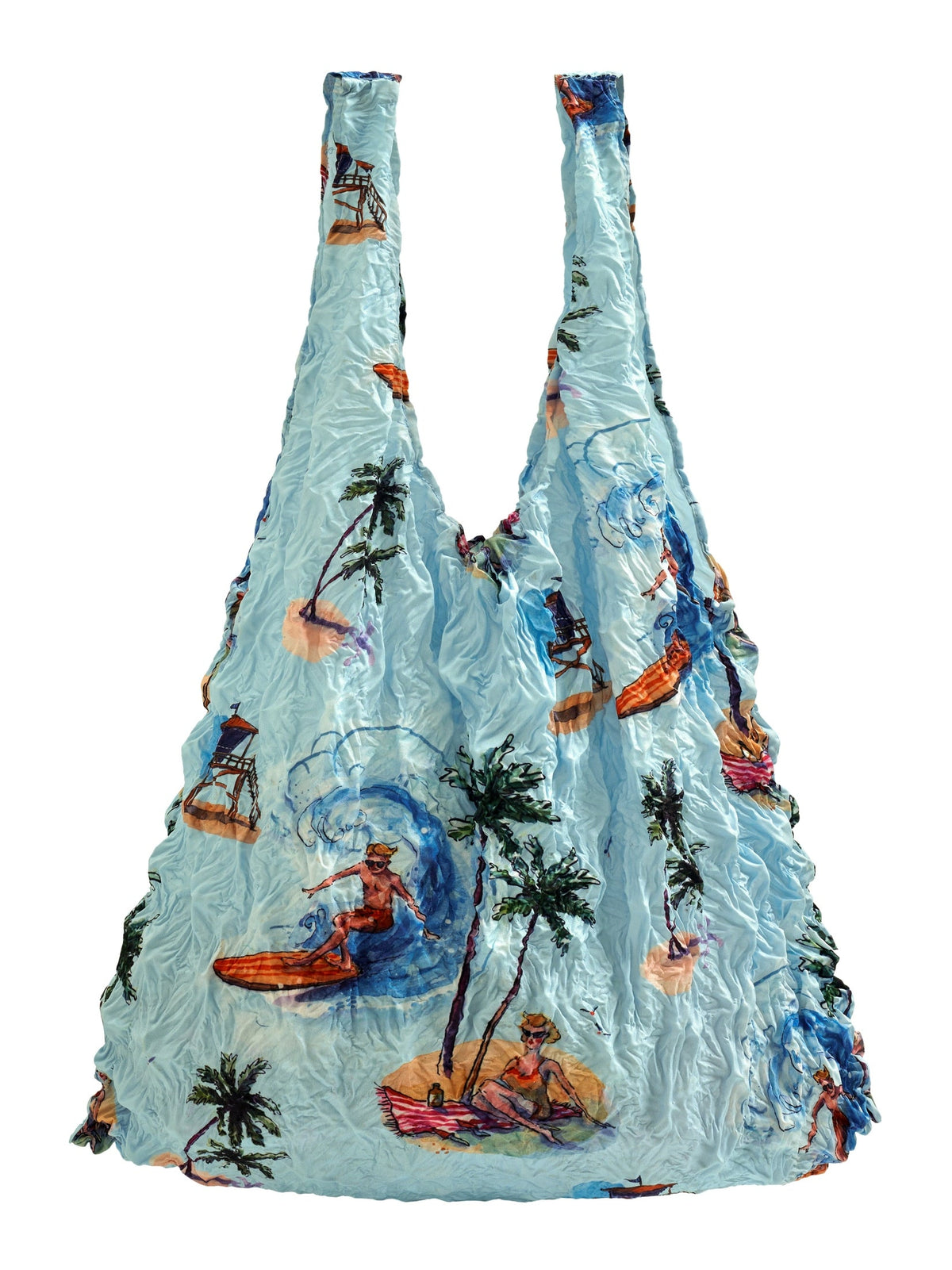 Be Bougie sustainable stretchy tote bag in light blue with tropical beach, surfing, and palm tree illustrations.