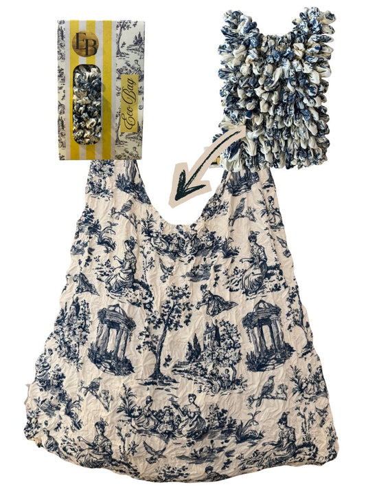 Be Bougie blue and white toile print sustainable stretchy eco tote bag with a crinkled texture and elegant pattern.