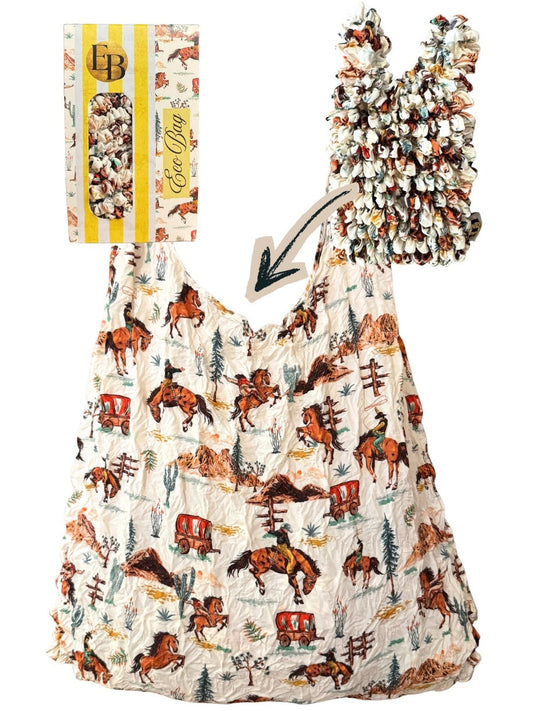 Be Bougie Yeeha! western-themed sustainable stretchy tote bag with cowboy print, shown folded and expanded.