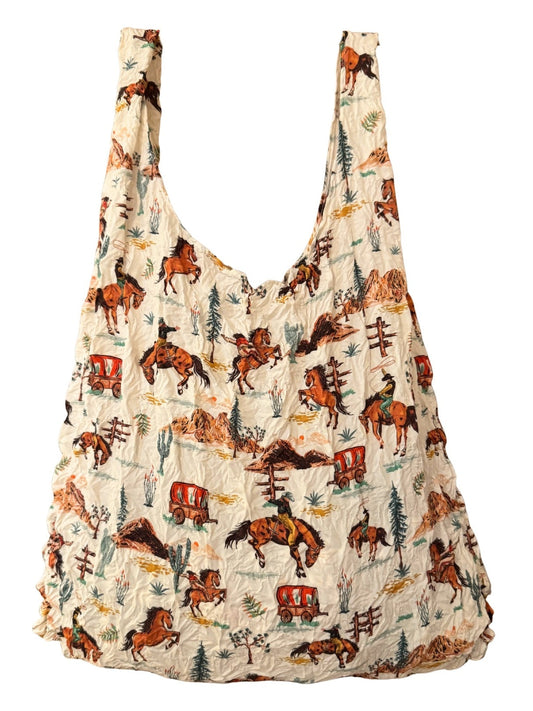 Be Bougie sustainable stretchy tote bag featuring a cream background with a vintage western cowboy horse print
