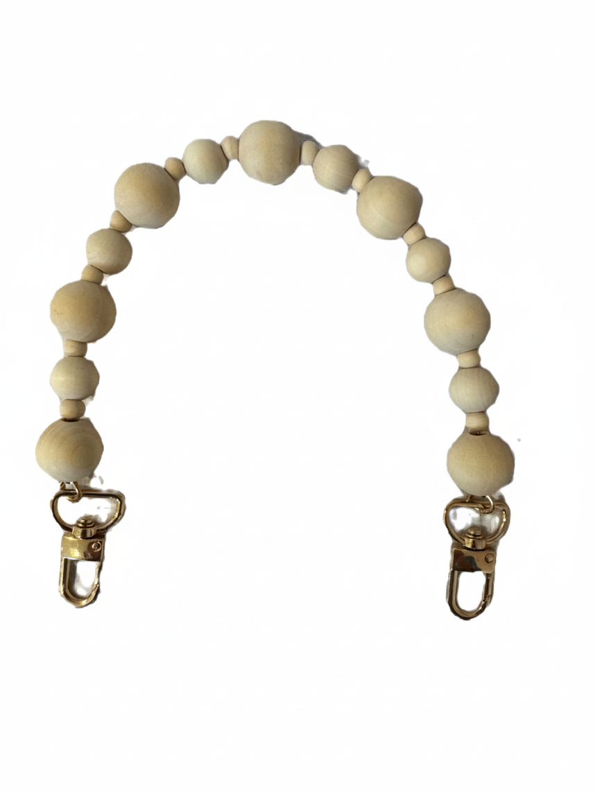 Be Bougie wooden bead bag handle with gold-toned lobster clasps for a bohemian and artisanal accessory look.